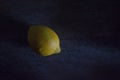 Lemon in darkness with chiaroscuro