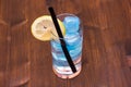 Lemon drink with blue ice on a wood from above Royalty Free Stock Photo