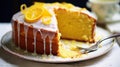 A lemon drizzle cake with a tangy glaze and zest