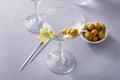 Lemon drop martini cocktail with olives and a lemon twist Royalty Free Stock Photo