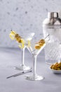 Lemon drop martini cocktail with olives and a lemon twist Royalty Free Stock Photo