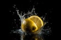 Lemon drop in water. Water splash on black background.