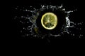 Lemon is dropped in water splash Royalty Free Stock Photo