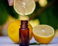 lemon essential oil and lemon fruit on a wooden white board Royalty Free Stock Photo