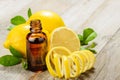 Lemon essential oil and lemon fruit Royalty Free Stock Photo