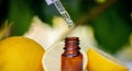 lemon essential oil and lemon fruit on a wooden white board Royalty Free Stock Photo