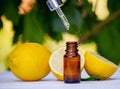 lemon essential oil and lemon fruit on a wooden white board Royalty Free Stock Photo