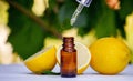 lemon essential oil and lemon fruit on a wooden white board Royalty Free Stock Photo