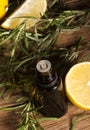 Lemon essential oil and rosemary Royalty Free Stock Photo