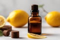 Lemon Essential Oil In Small Brown Bottle Next To Lemon On White Background. Generative AI