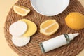 Lemon face cleanser. Fresh citrus fruits and personal care products on wicker mat, closeup Royalty Free Stock Photo