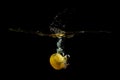 Lemon fell into the water and picked up a lot of splashes Royalty Free Stock Photo