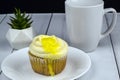 Lemon filled cup cake with a cup of coffee Royalty Free Stock Photo