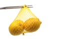 Lemon on a fork in a net Royalty Free Stock Photo
