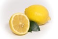 Lemon fruit and half a lemon with green leaf