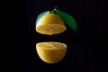 Lemon fruit with leaf isolated on black background