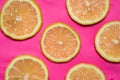 Lemon fruit slices on pink background flat lay Royalty Free Stock Photo