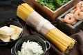 Lemon Garlic Cheese Shrimp with Spaghetti Ingredients classic recipe, on old dark wooden table background