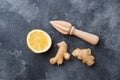 Lemon and ginger root on dark grey background with copy space. Ingredients for a tonic vitamin drink Royalty Free Stock Photo