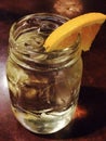 Lemon ice tea in mason jar with wedge of lemon Royalty Free Stock Photo