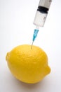 Lemon injected with syringe