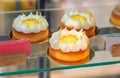 Lemon Japanese cakes close-up, on a showcase in a cafe