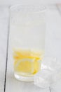 Lemon juice detox water. Mineral water infused with lemons. Wooden white table.