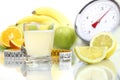 Lemon juice poured in glass, fruit meter scales diet food