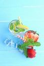 Lemon juice and strawberry juice mixing soda no alcohol in the glass garnish with mint leaves, sliced lime, and half a strawberry Royalty Free Stock Photo