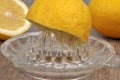 Lemon on a juicer close-up Royalty Free Stock Photo