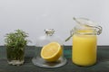 Lemon Kurd in a glass jar. Nearby is half a lemon in a glass container with a lid and a bunch of rosemary in a glass. Stand on Royalty Free Stock Photo