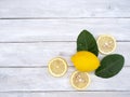 Lemon with leaves on white wooden Royalty Free Stock Photo