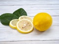 Lemon with leaves on white wooden Royalty Free Stock Photo