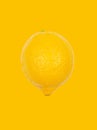 Lemon levitate in air on yellow background. Concept of fruit levitation Royalty Free Stock Photo