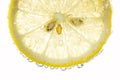 Lemon and lime drop in fizzy sparkling water, juice Royalty Free Stock Photo