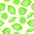 Lemon or lime fruits and slices on soft yellow background