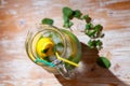 Lemon and lime in a jag on wooden table Royalty Free Stock Photo