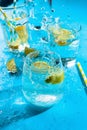 Lemon and lime water in various glasses, summer drink concept