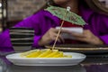 Lemon lobules with umbrella toothpick. Tea time. Royalty Free Stock Photo