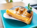 Lemon meringe cheese tart on blue dish