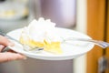 Lemon meringue pie on white plate with spoon and fork Royalty Free Stock Photo