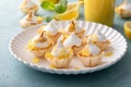 Lemon meringue tartlets in filo pastry shells