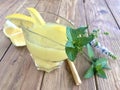 Lemon and mint limonade on the wooden table.