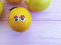 Lemon orange exotic cartoon looking eyes wooden personage