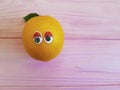 Lemon orange funny cartoon friendly eyes wooden personage