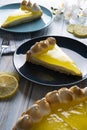 Lemon pie with tea on a breakfast wooden table