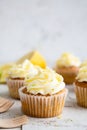 Lemon and poppy seed cupcakes with cheese cream frosting Royalty Free Stock Photo