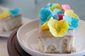 Lemon and poppy seeds loaf cake decorated with pastel fondant flowers Royalty Free Stock Photo