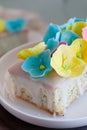 Lemon and poppy seeds loaf cake decorated with pastel fondant flowers Royalty Free Stock Photo