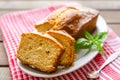 Lemon pound cake on rustic wooden background with lemon